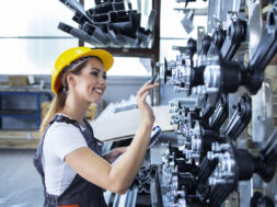 woman-industrial-employee-working-uniform-hardhat-checking-production-factory